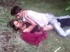 Indian duo fools around in the grass